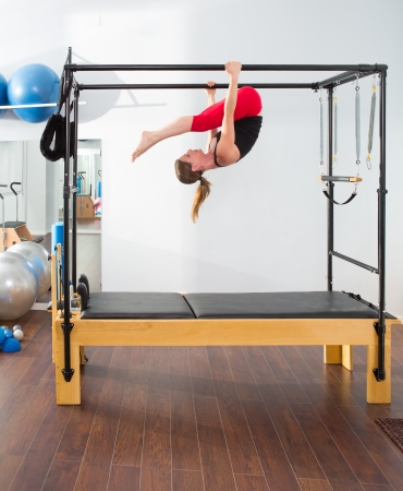 Aerobics pilates instructor woman in cadillac fitness exerciseの写真素材