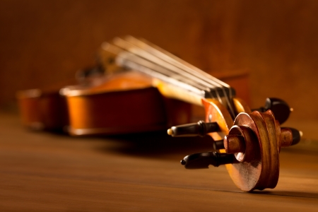 Classic music violin vintage in wooden golden backgroundの写真素材