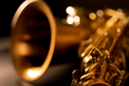 Tenor sax golden saxophone macro with selective focus on black Tenor sax golden saxophone macro with selective focus on black