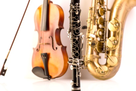 Music Sax tenor saxophone violin and clarinet in white background
