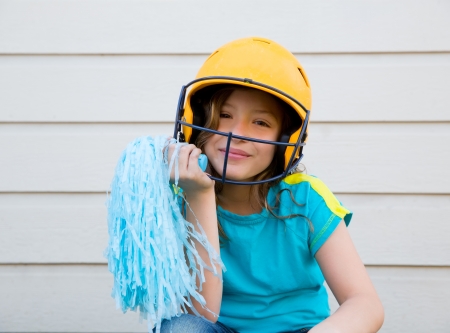 baseball cheerleading pom poms girl happy smiling with yellow helmetの写真素材