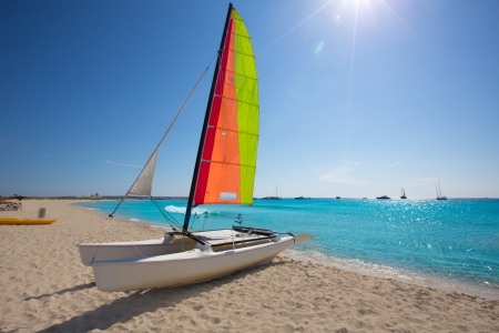 Catamaran sailboat in Illetes beach of Formentera at Balearic Islandsの写真素材
