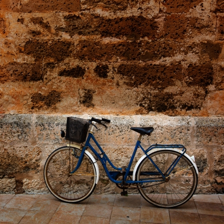 Bicycle in historical Ciutadella stone wall at Balearic islandsの写真素材