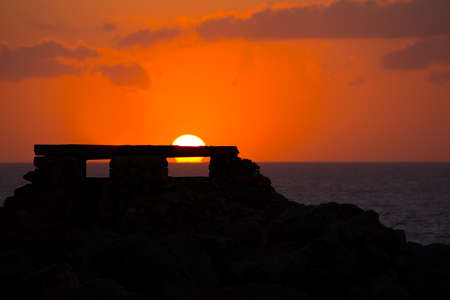 Ciutadella Menorca at Punta Nati orange sunset in Baearic Islandsの写真素材
