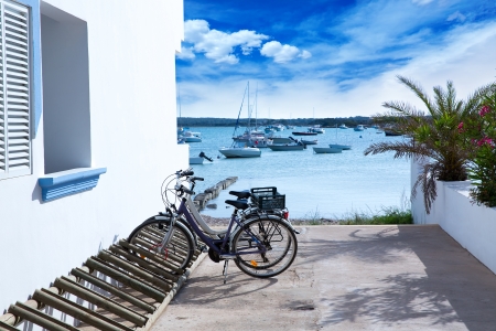 Estany des Peix in formentera with bicycles parking lot and white Mediterranean housesの写真素材
