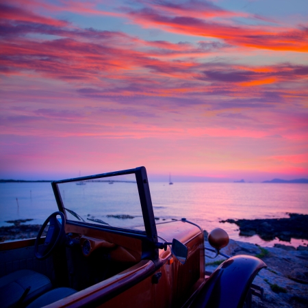 Ibiza sunset view from vintage car at formentera Island in Balearic Islandsの写真素材