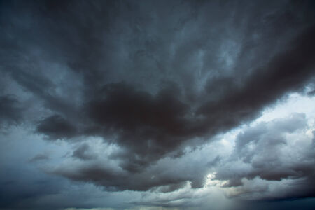 Stormy clouds gray low key sky with dramatic shadows and lights