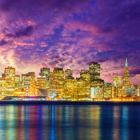 San Francisco sunset skyline in California with reflection in bay water USAの写真素材