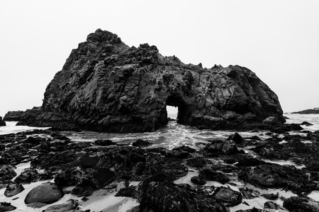California Pfeiffer Beach in Big Sur State Park dramatic black and white rocks and wavesの写真素材