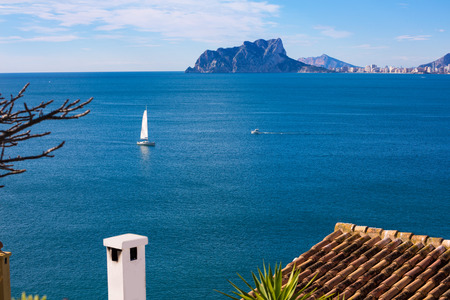 Ifach Penon view of calpe and Sailboat from Moraira in Mediterranean Alicante at Spainの写真素材