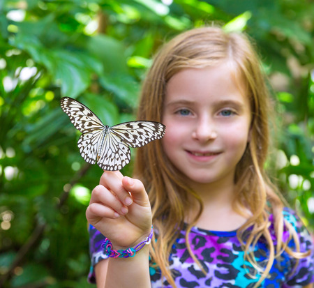 Girl holding finger Rice Paper butterfly Idea leuconoe in outdoorの写真素材