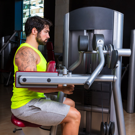 Deltoids fly machine man for shoulders workout at gym