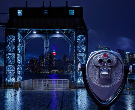Manhattan New York skyline rainy night East River floodgates and telescope photomountの写真素材