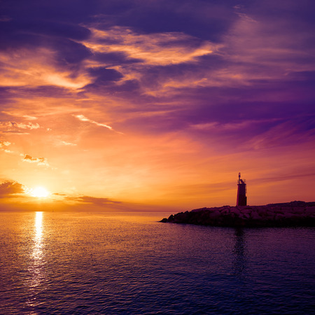 Denia sunset lighthouse at dusk in Alicante at spainの写真素材