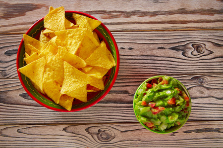 Guacamole with avocado tomatoes and nachos mexican foodの写真素材