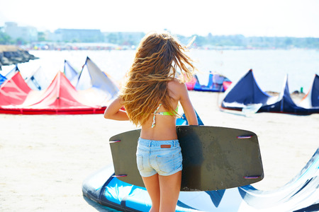 Blond kite surf teen girl in summer beach at Mediterraneanの写真素材