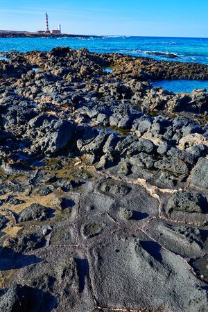 El Cotillo beach and Toston lighthouse at Fuerteventura Canary Islands