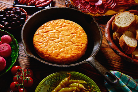 Tapas tortilla de patata potatoes omelette in a pan from Spain