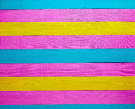 Mexican wood background colorful pink yellow and turquoiseの写真素材