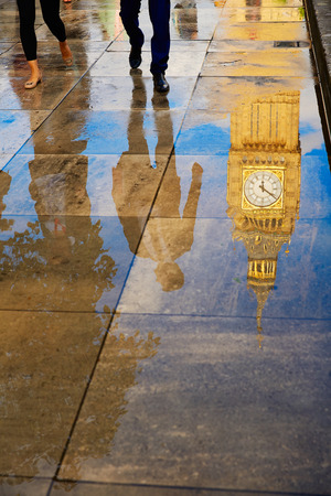 Big Ben Clock Tower puddle water reflection in London Englandの写真素材