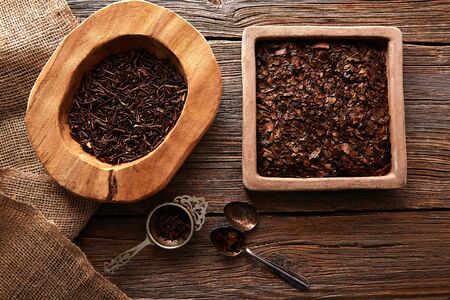 Kukicha and Bancha tea on wooden background table boardの写真素材