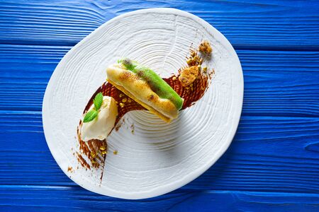 Caramelized cinnamon and pistachio cream millefeuille dessert