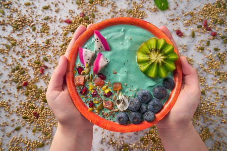 Acai bowl smoothie with kiwi blueberry seeds and pitaya dragon fruitの写真素材