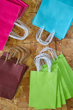 Paper bags factory colorful set on wooden backgroundの写真素材