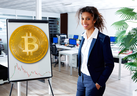 african ethnic woman in Bitcoin presentation board at officeの写真素材