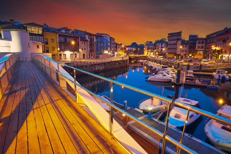 Llanes marina port sunset in Asturias of Spainの写真素材