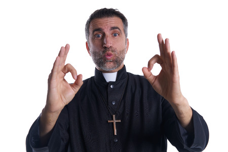 Priest with ok finger hands sign isolated backgroundの写真素材