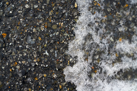 Iced asphalt road pavement detail in winterの写真素材
