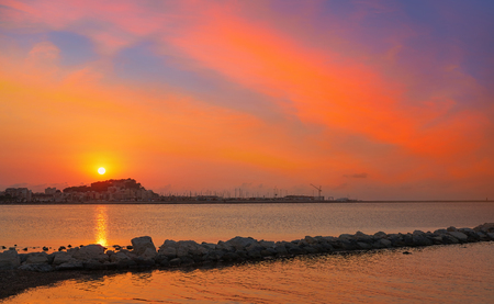Denia beach Las Rotas at sunset in Mediterranean of Alicante spainの写真素材