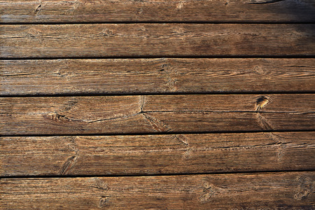 Aged weathered wood plank board on a beach background