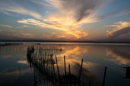 Sunset over the lake in the coast of Valenciaの写真素材