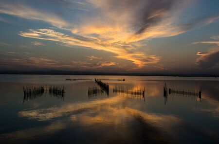 Sunset over the lake in the coast of Valenciaの写真素材
