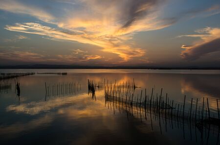 Sunset over the lake in the coast of Valenciaの写真素材