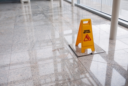 wet floor sign on lobby floor