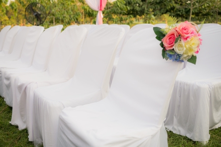 Empty white chairs in outdoor weddingの写真素材