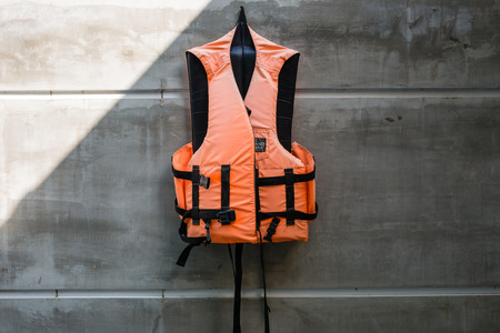 Hanging old life saving vestの写真素材