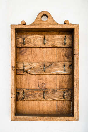 Vintage wooden hanging keyの写真素材