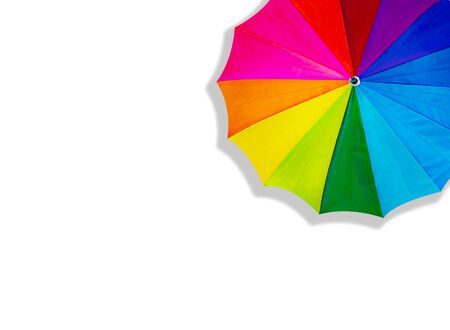 Close up rainbow umbrella red green blue yellow orange purple color for rain and sun protect on white background and top view with coppy space.の写真素材