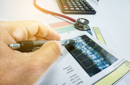 Closeup Artificial intelligence in smart healthcare hospital technology concept. Doctor point pen to...