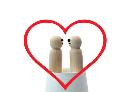 Wooden little figures love on white background.Valentine concept.