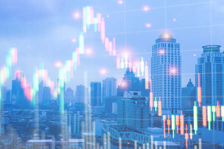 Double exposure of graph Stock market exchange on blurred photo of city scenery background, business...