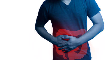 Closeup  man's body against white background, People With Stomach ache of large intestine in body ,Medical problem concept,の写真素材