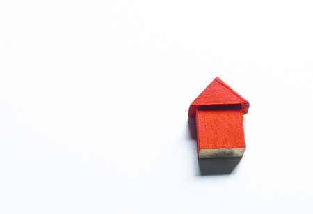 Small  wooden red houses with modern design white background for home loans conceptの写真素材