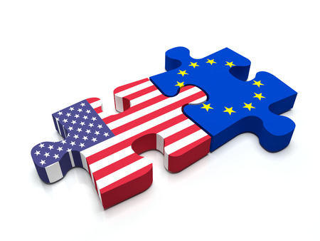 Puzzle pieces connect a piece containing the European Union Flag and the US flag.の写真素材
