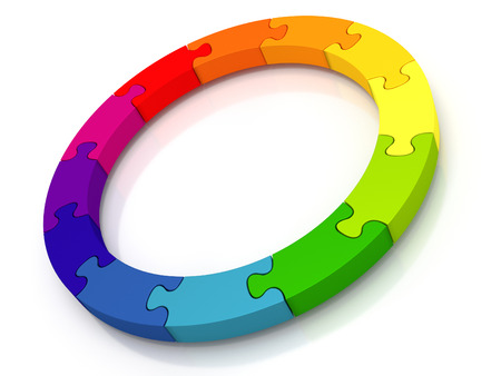 Circle of jigsaw pieces - A circle containing 12 colored jigsaw pieces isolated from a white backgroundの写真素材