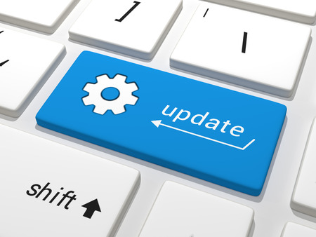 Software Update - A blue key on a white keyboard containing the text update.の写真素材